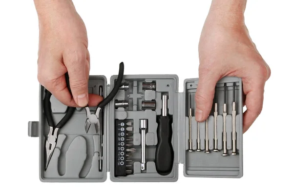 The technician elderly repairman takes from the tool set steel s — Stock Photo, Image