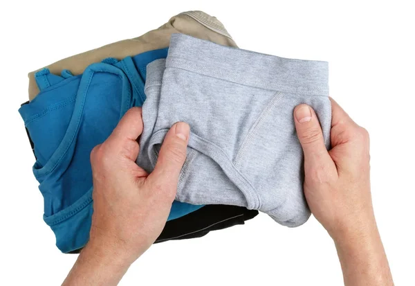 An elderly man chooses his clean panties to meet a new woman — Stock Photo, Image