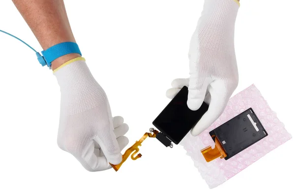 A technician in  repairman antistatic gloves hold  the display t — Stock Photo, Image