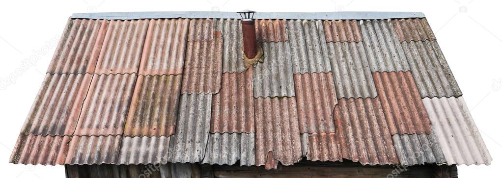 Gray and red aged broken panels of an asbestos tiles on shed iso