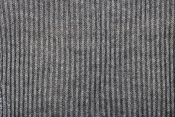 Sweter jest związany z linii wątki grubych szwów szary. — Zdjęcie stockowe