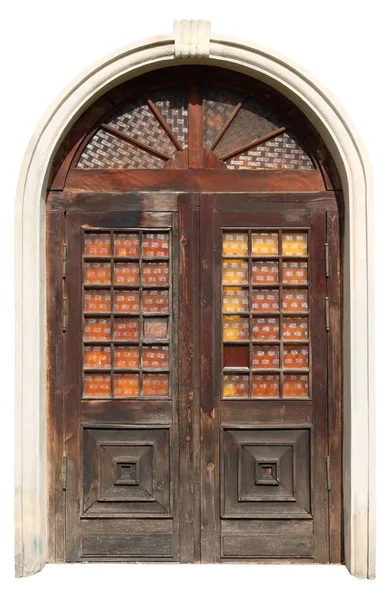 Ancient wooden arched door with decorative square pieces of corr — Stock Photo, Image