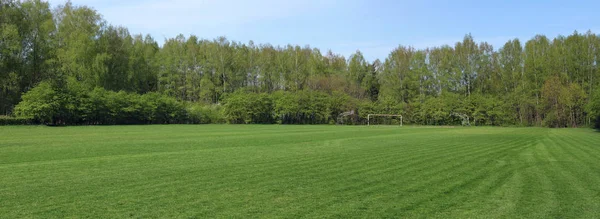 Panorama of the freshly cut spring football lawn of the club of — Stock Photo, Image