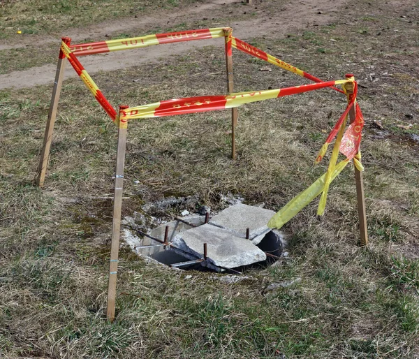 Destroyed Sewer Well Bounded Yellow Tape Words Stop Natural Colors — Stock Photo, Image