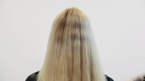 Woman Hand With Red Nail Polish Combing Brush Blonde Dyed Hair