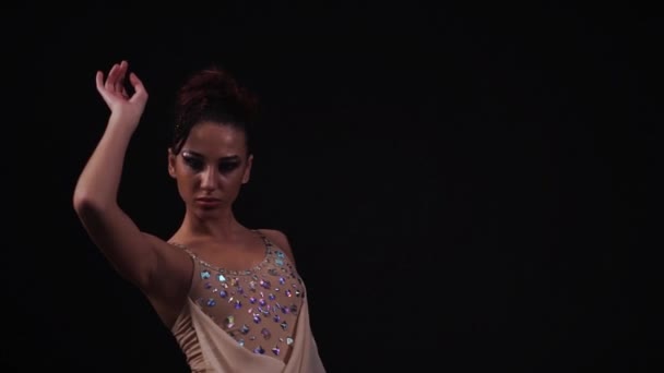 Contortionist in beige leotard with diamonds make bracing ...