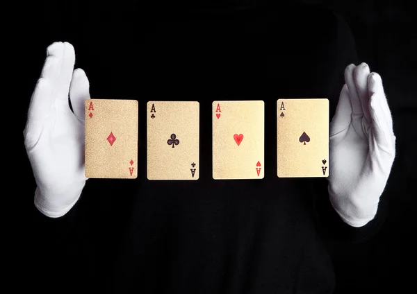 Playing cards trick with ace hands with gloves — Stock Photo, Image