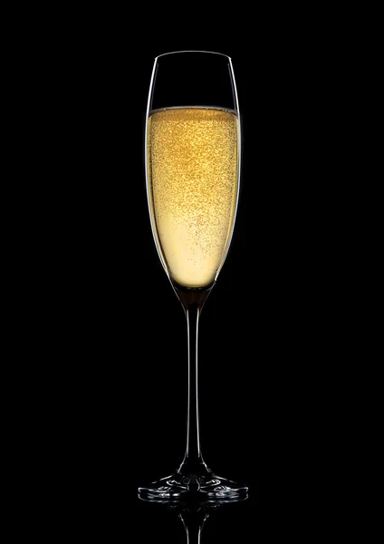 Glass of sparkling champagne with bubbles on black — Stock Photo, Image