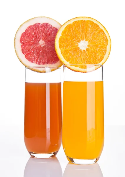 Glasses of healthy grapefruit  and orange juice — Stock Photo, Image