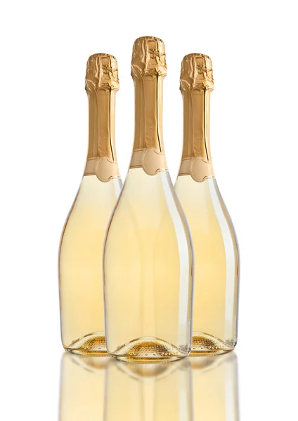 Bottles of champagne golden yellow color on white — Stock fotografie