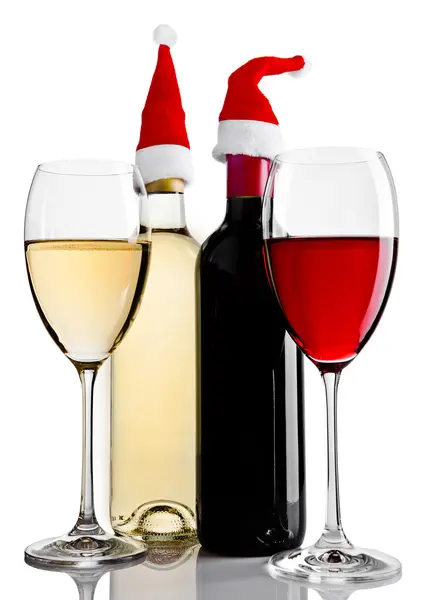 Bottles and glasses of red white wine santa hat — Stockfoto