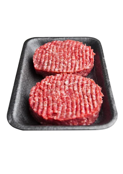 Zásobník s raw beed hamburgery, samostatný — Stock fotografie