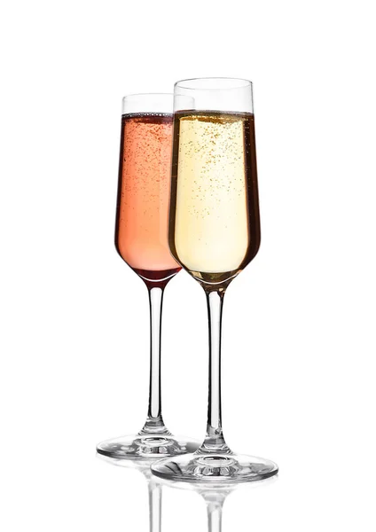 Brýle růžové a žluté šampaňské na bílém — Stock fotografie