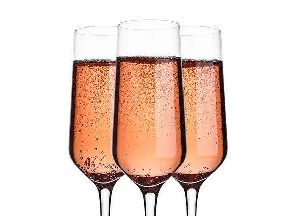 Růžové růže šampaňské s bublinkami na bílém — Stock fotografie