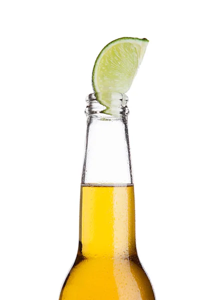 Mexican beer bottle with lime slice and frost — Stock Photo, Image