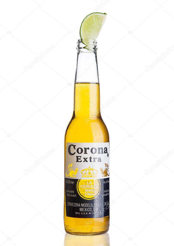 LONDON, UNITED KINGDOM - NOVEMBER 04, 2016: Bottle of Corona Extra Beer with lime slice.Corona, produced by Grupo Modelo with Anheuser Busch InBev, is the most popular imported beer in the US.