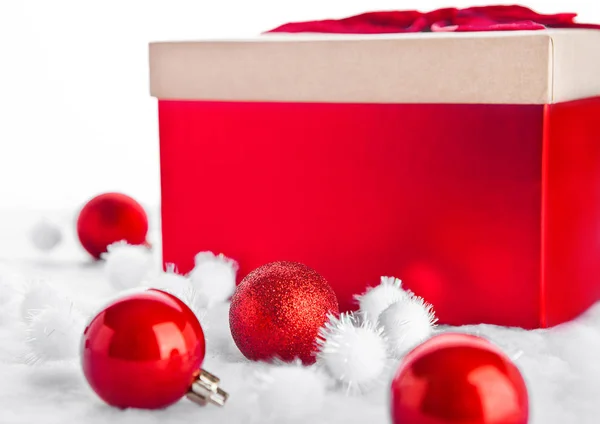 Red gift box for christmas with toys and snow Royalty Free Stock Images