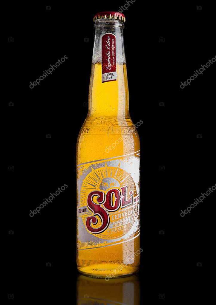 LONDON, UK - DECEMBER 15, 2016: Bottle of Sol Mexican Beer on black background. From the Cuauhtemoc Moctezuma Brewery, in Monterey, Mexico, it was first introduced in the 1890's as El Sol.