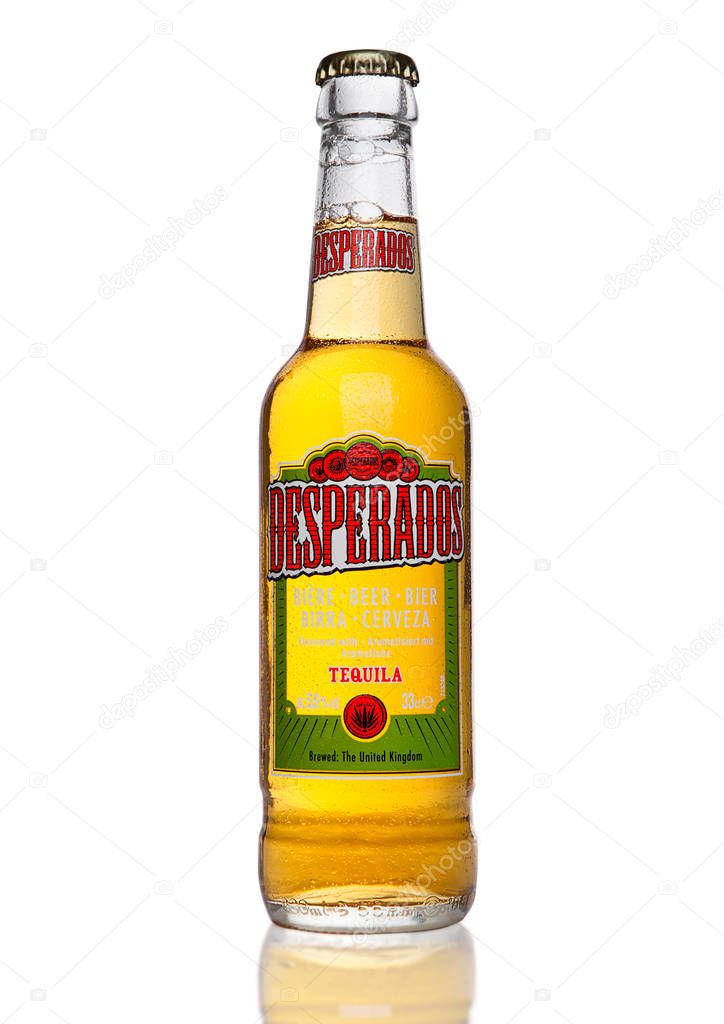 LONDON, UK - JANUARY 02, 2017: Bottle of Desperados beer on black background, lager flavored with tequila is a popular beer produced by Heineken and sold in over 50 countries around the world.