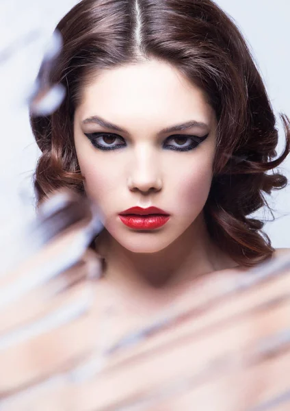 Beauty woman model with makeup through mirror — Stock Photo, Image