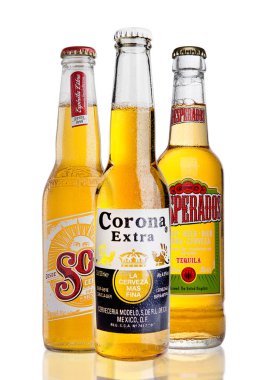 LONDON, UNITED KINGDOM - FEBRUARY 26, 2017: Bottles of Corona Extra  and Sol and Desperados Beer on white.  clipart