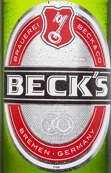 LONDON, UK - MARCH 15, 2017: Bottle close up logo of Becks beer on white background. Becks brewery was founded in 1873 in Bremen, Germany.