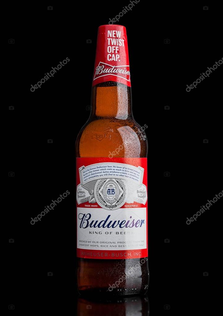 LONDON,UK - MARCH 21, 2017 : Bottle of Budweiser Beer with new twist off cap on black background. An American lager first introduced in 1876.