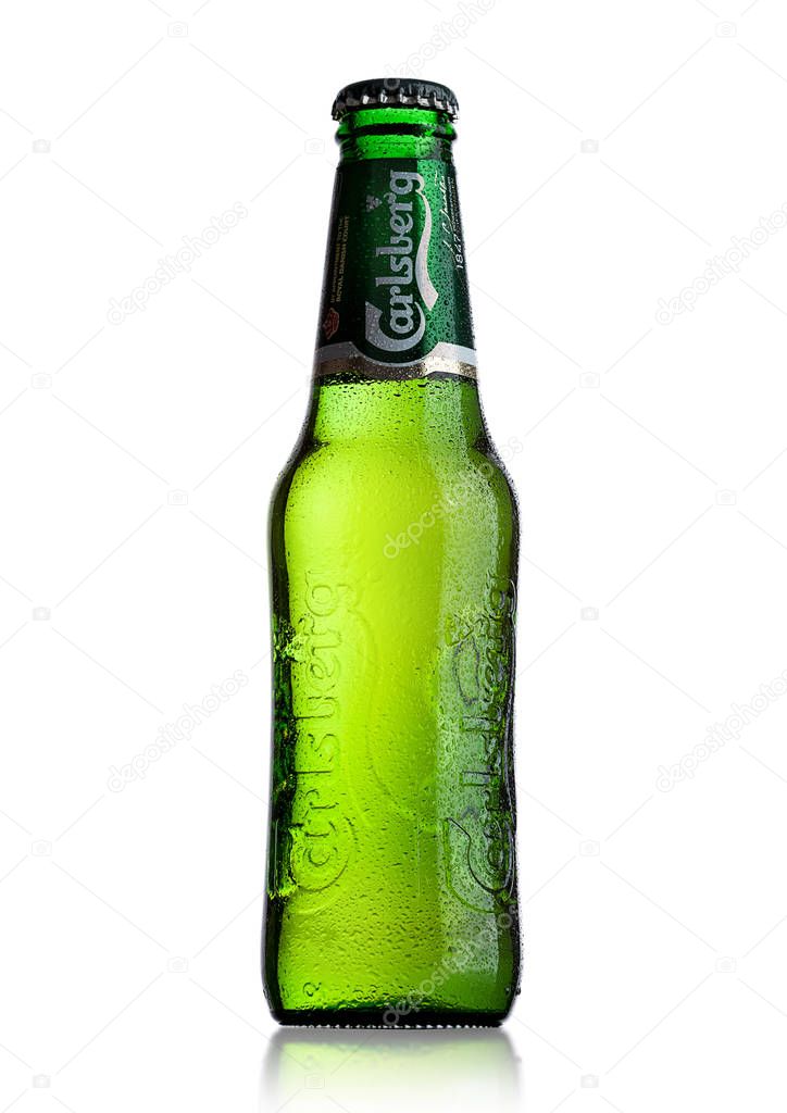 LONDON, UK - MAY 29, 2017: Bottle Of Carlsberg beer on white background. Danish brewing company founded in 1847.