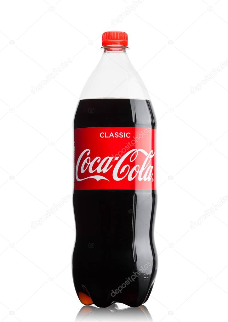 LONDON, UK - JUNE 9, 2017: Bottle of Coca cola soft drink on white background.The Coca-Cola Company, an American multinational beverage corporation.