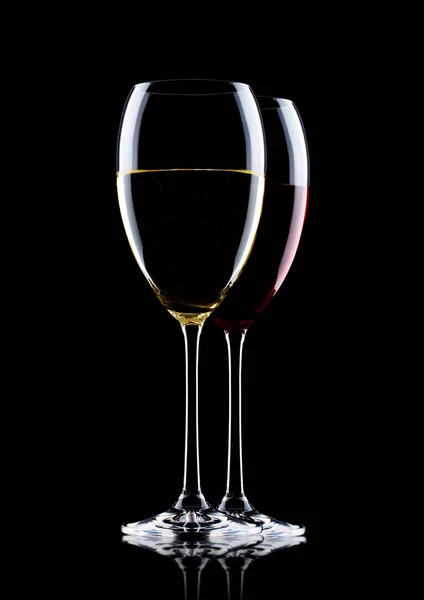 Glasses of red and white wine on black — Stock Photo, Image