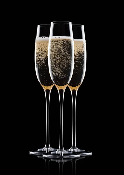 Yellow champagne glasses with bubbles isolated — Stock Photo, Image