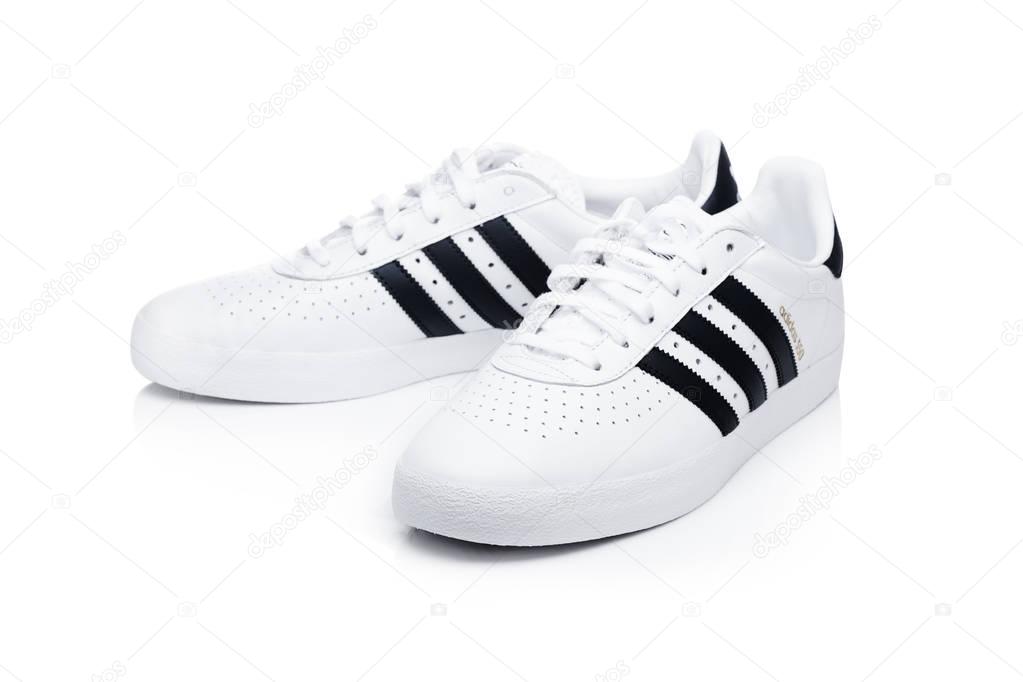LONDON, UK - JANUARY 02, 2018: Adidas Originals shoes on white background. German multinational corporation that designs and manufactures sports shoes, clothing and accessories.