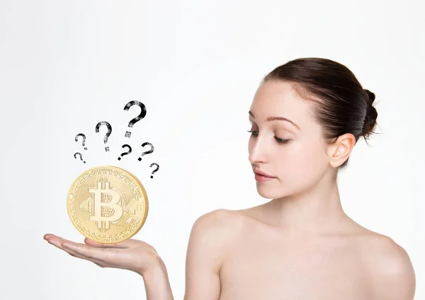 Girl holding bitcoin on her hand with question — Stock Photo, Image