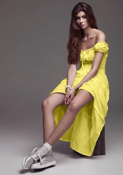 Beautiful young girl fashion girl in yellow dress