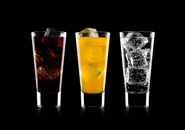 Glasses of cola and orange soda drink and lemonade — Stock Photo, Image