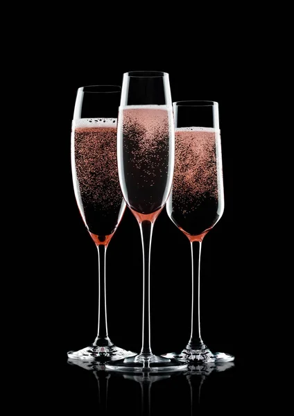 Rose pink champagne glasses with bubbles