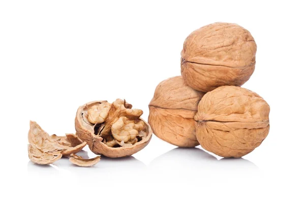 Raw walnuts with shell on white background — Stock Photo, Image