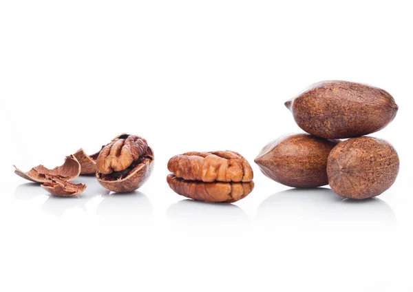Raw pecans with shell on white background — Stock Photo, Image