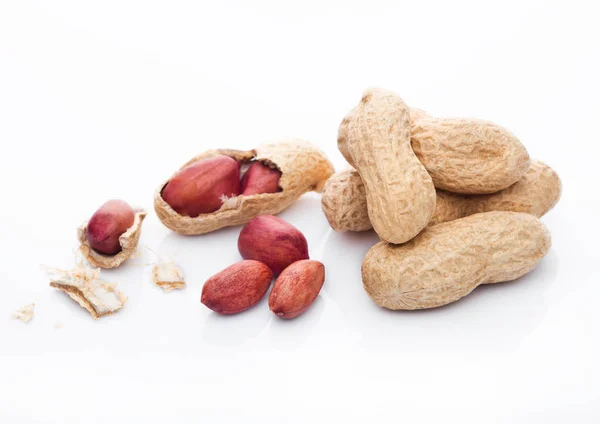 Raw peanuts with shell on white background — Stock Photo, Image