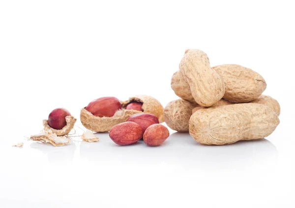 Raw peanuts with shell on white background — Stock Photo, Image