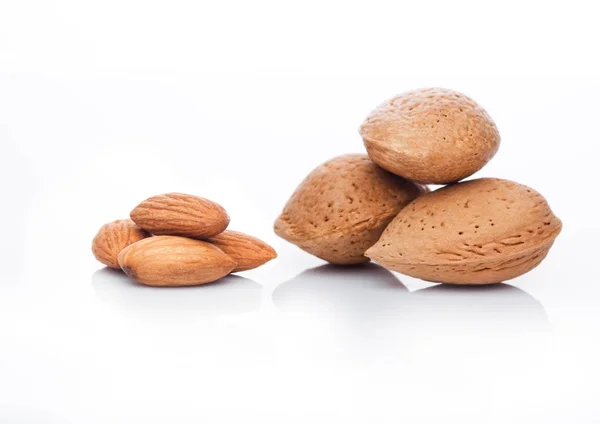 Raw almonds nuts with shell on white background — Stock Photo, Image