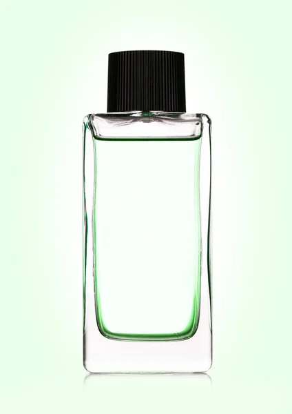 Lüks yeşil sıvı parfüm şişesi üzerinde beyaz — Stok fotoğraf