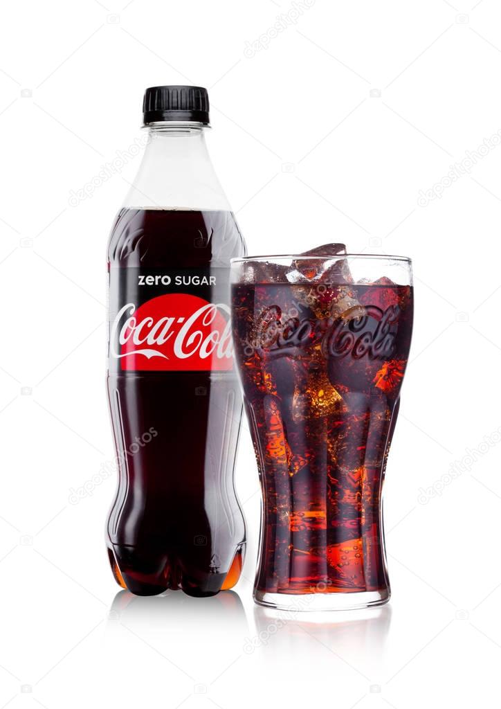 LONDON, UK - JANUARY 24, 2018: Bottle and glass of Zero  Coca-Cola on white Background. Coca-Cola is one of the most popular soda products in the world.
