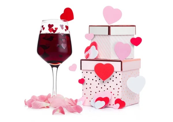 Glass of red wine with heart and pink gift box — Stock Photo, Image