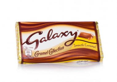 LONDON, UK - FEBRUARY 02, 2018: An unopened Galaxy chocolate bar with smooth caramel on white.Manufactured by Mars clipart