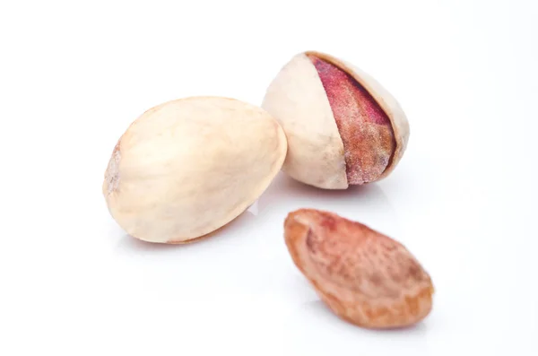 Fresh salthy pistachio nuts on white background — Stock Photo, Image