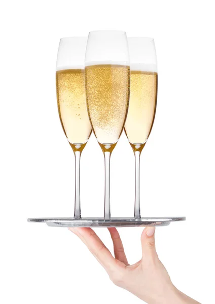 El tepsisi bardak sarı şampanya ile taşıyabilir — Stok fotoğraf
