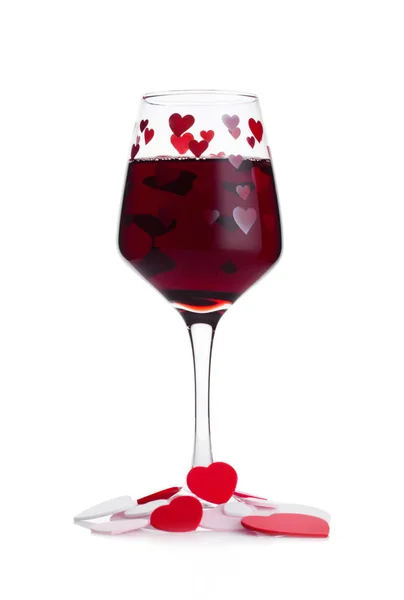 Glas rött vin med röda och rosa hjärta form — Stockfoto