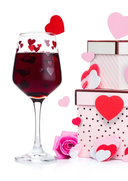 Glass of red wine with heart and pink gift box — Stock Photo, Image