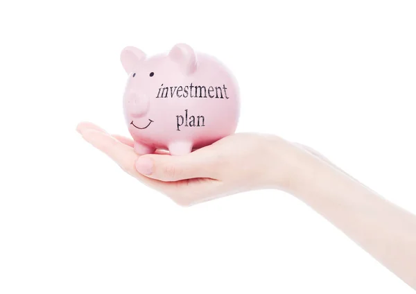 Mão feminina detém plano de investimento Piggy Bank — Fotografia de Stock